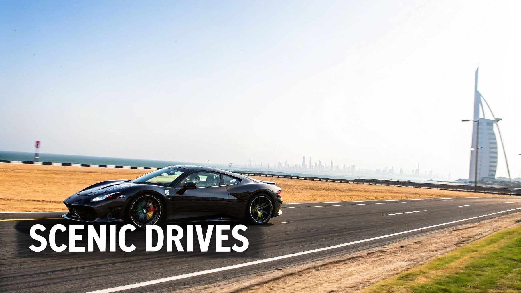 A black luxury sports car on a scenic road with the Dubai skyline and ocean in the background.