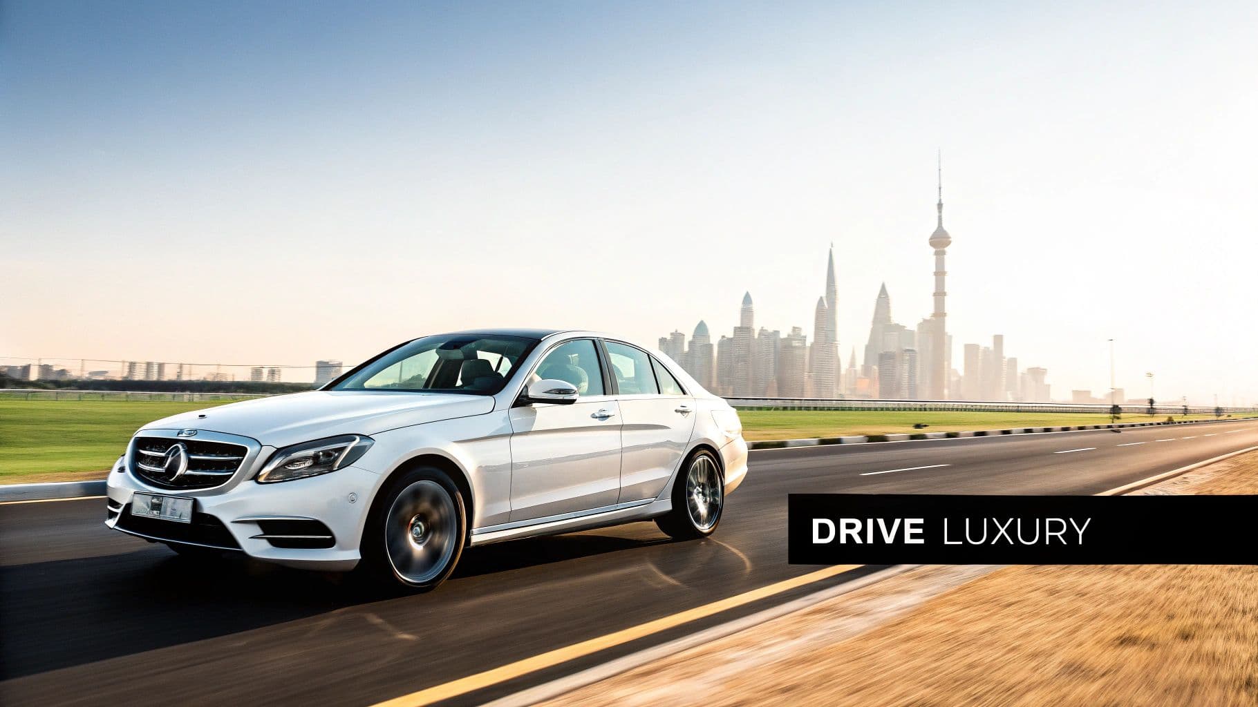 White Mercedes-Benz sedan driving on a highway with the iconic Dubai skyline in the background.
